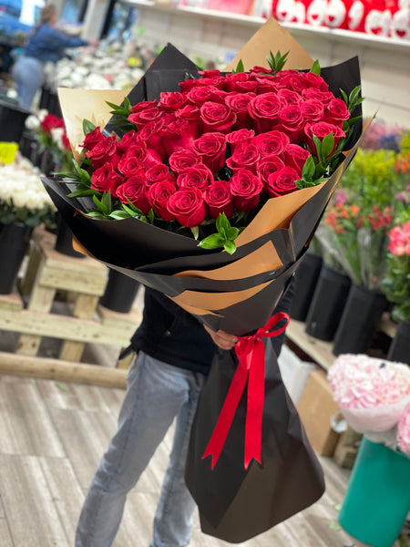 A Bouquet of Flowers Including Red Roses Wrapping Paper